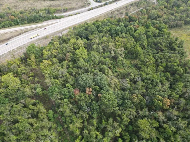 an aerial view of a houses with yard