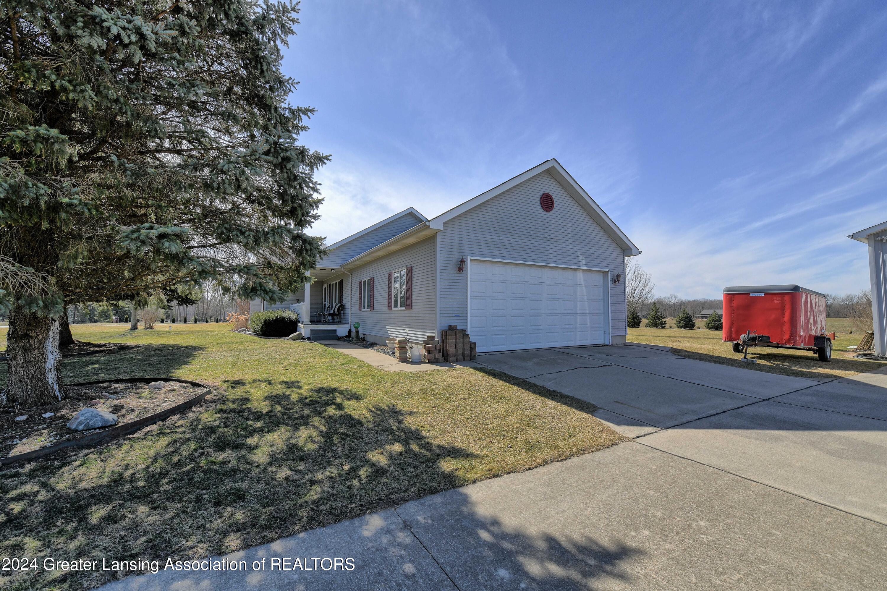 13222 South Grange Road Eagle, MI 48822 - Photo 24 of 38 2 car attached garage