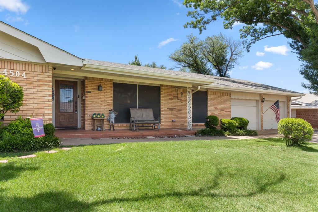 4504 Jennings Avenue Wichita Falls, TX 76310 - Photo 2 of 26 a front view of a house with a yard and garage
