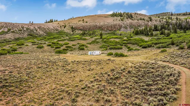 a view of mountain view with mountains in the background