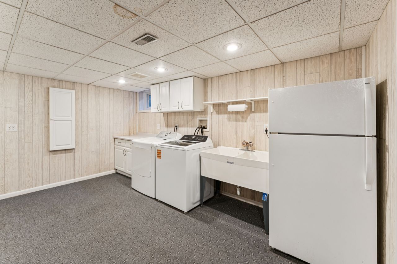 328 Windsor Lane Inverness, IL 60010 - Photo 25 of 33 a kitchen with refrigerator and white cabinets