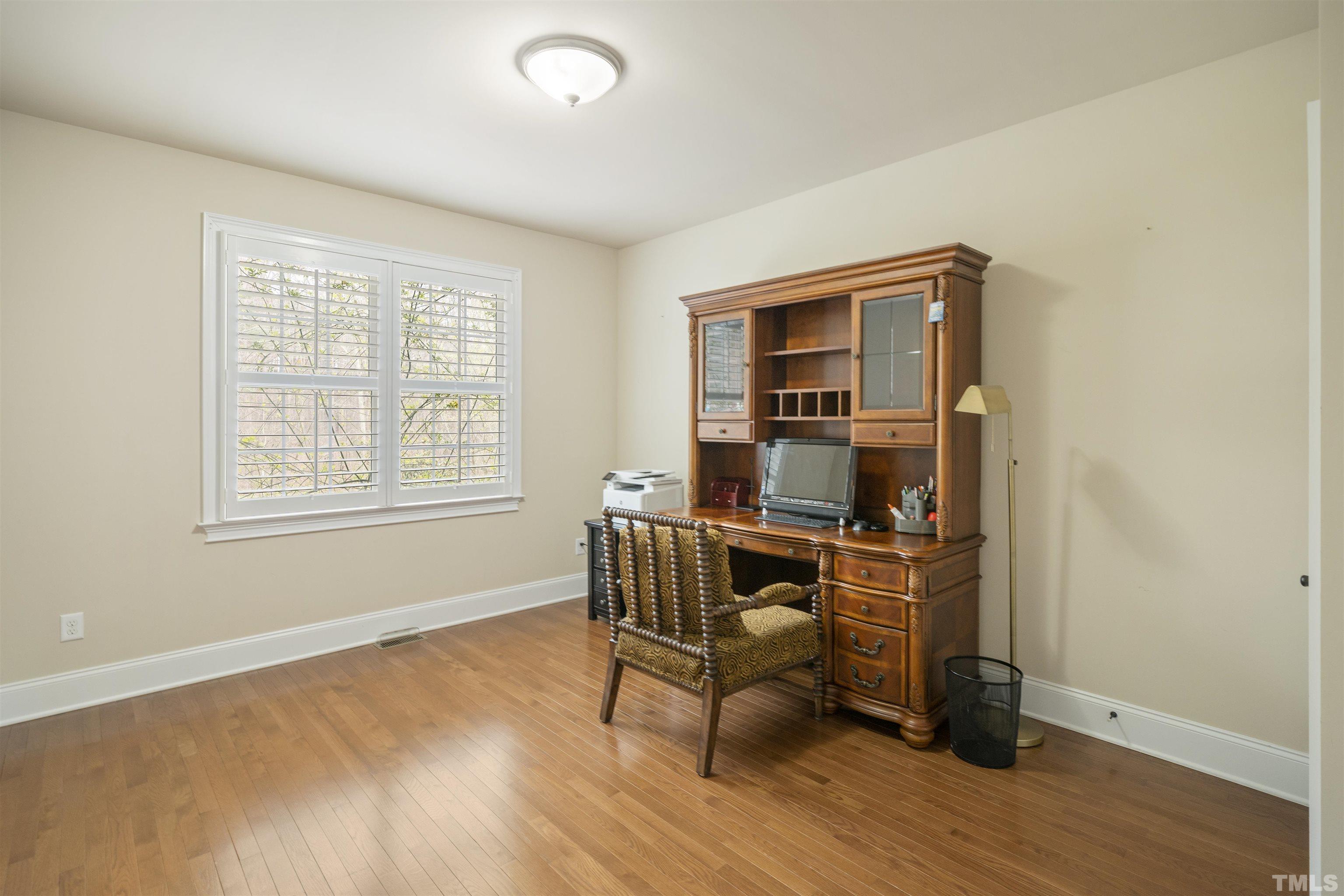 4109 Piney Gap Drive Cary, NC 27519 - Photo 12 of 39 a workspace room with wooden floor and windows