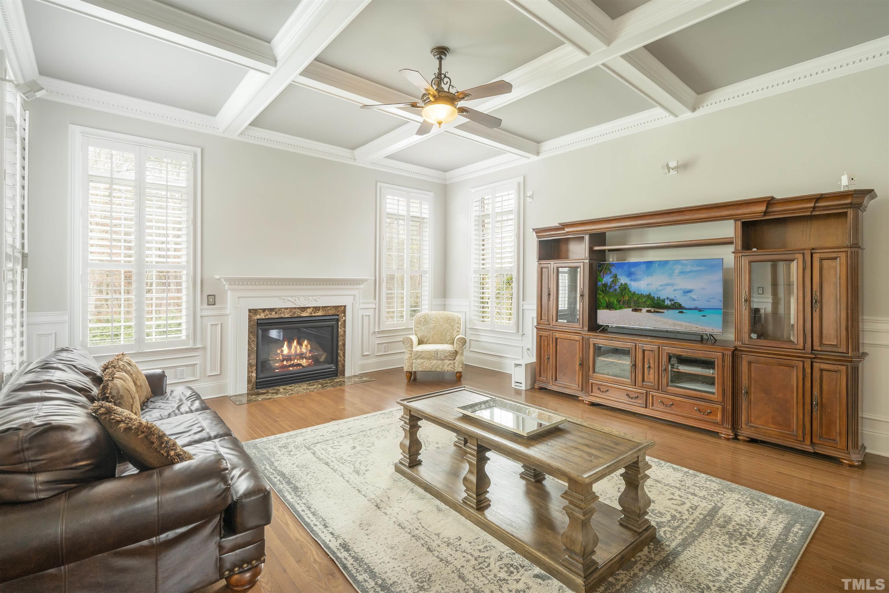 4109 Piney Gap Drive Cary, NC 27519 - Photo 13 of 39 a living room with furniture and a flat screen tv