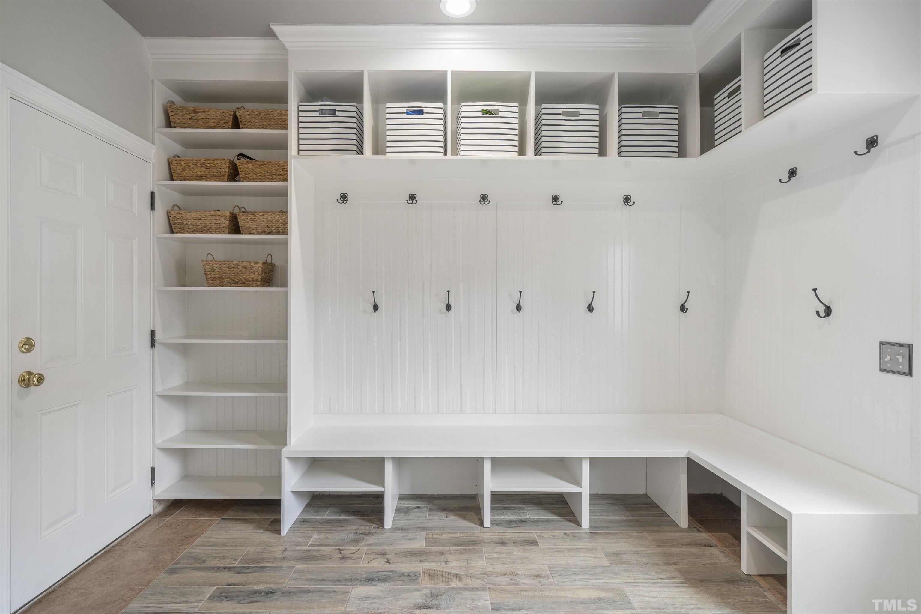 4109 Piney Gap Drive Cary, NC 27519 - Photo 14 of 39 a view of an empty room with cabinet and stairs