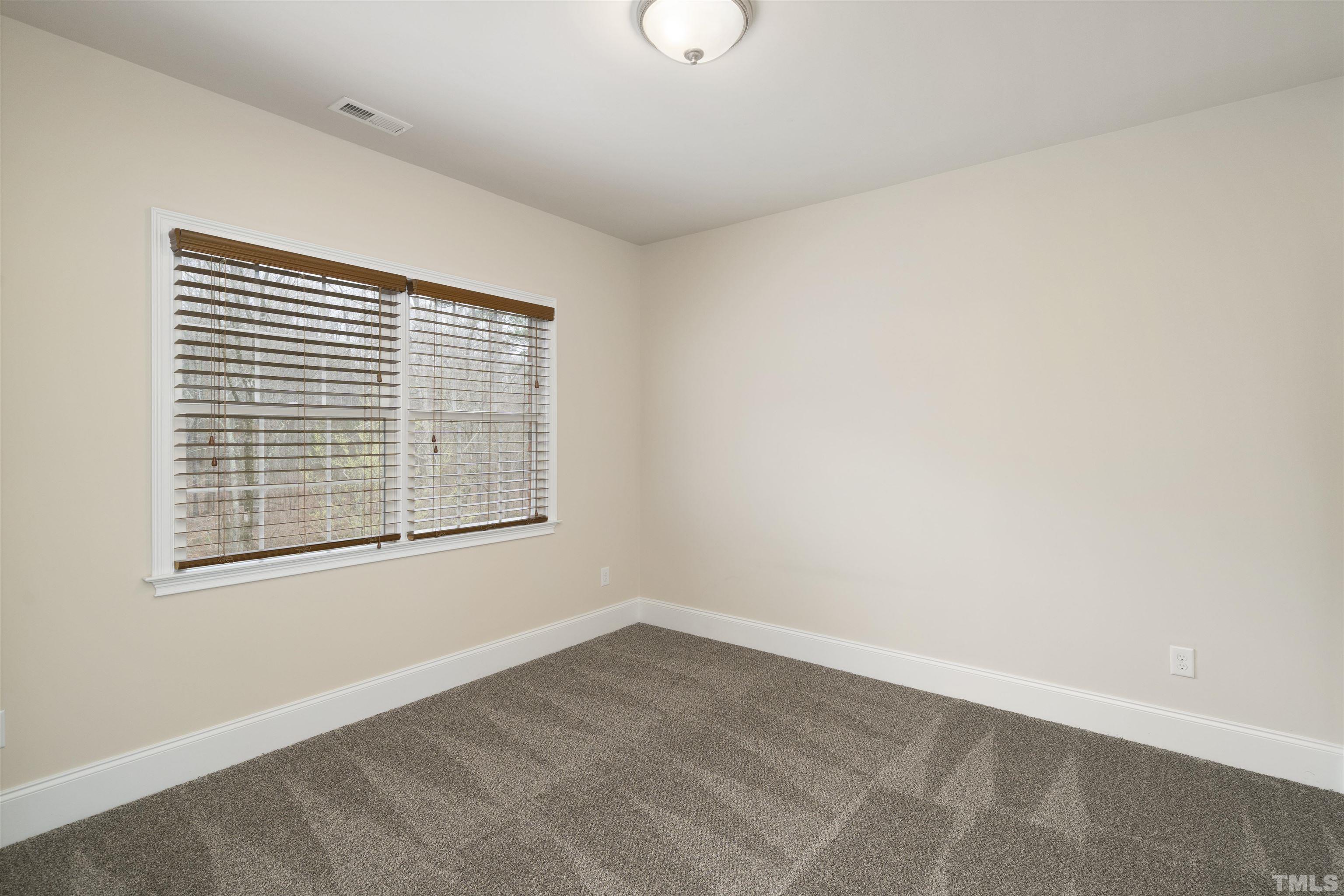 4109 Piney Gap Drive Cary, NC 27519 - Photo 17 of 39 a view of an empty room with a window
