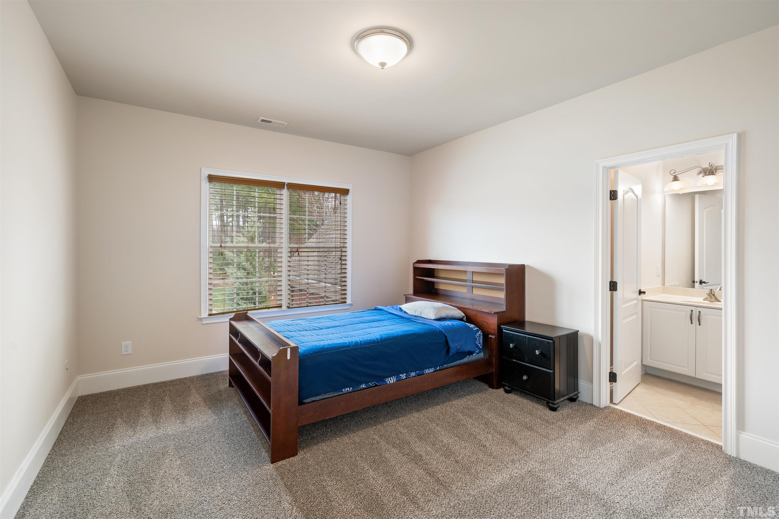 4109 Piney Gap Drive Cary, NC 27519 - Photo 20 of 39 a room with a bed and a window