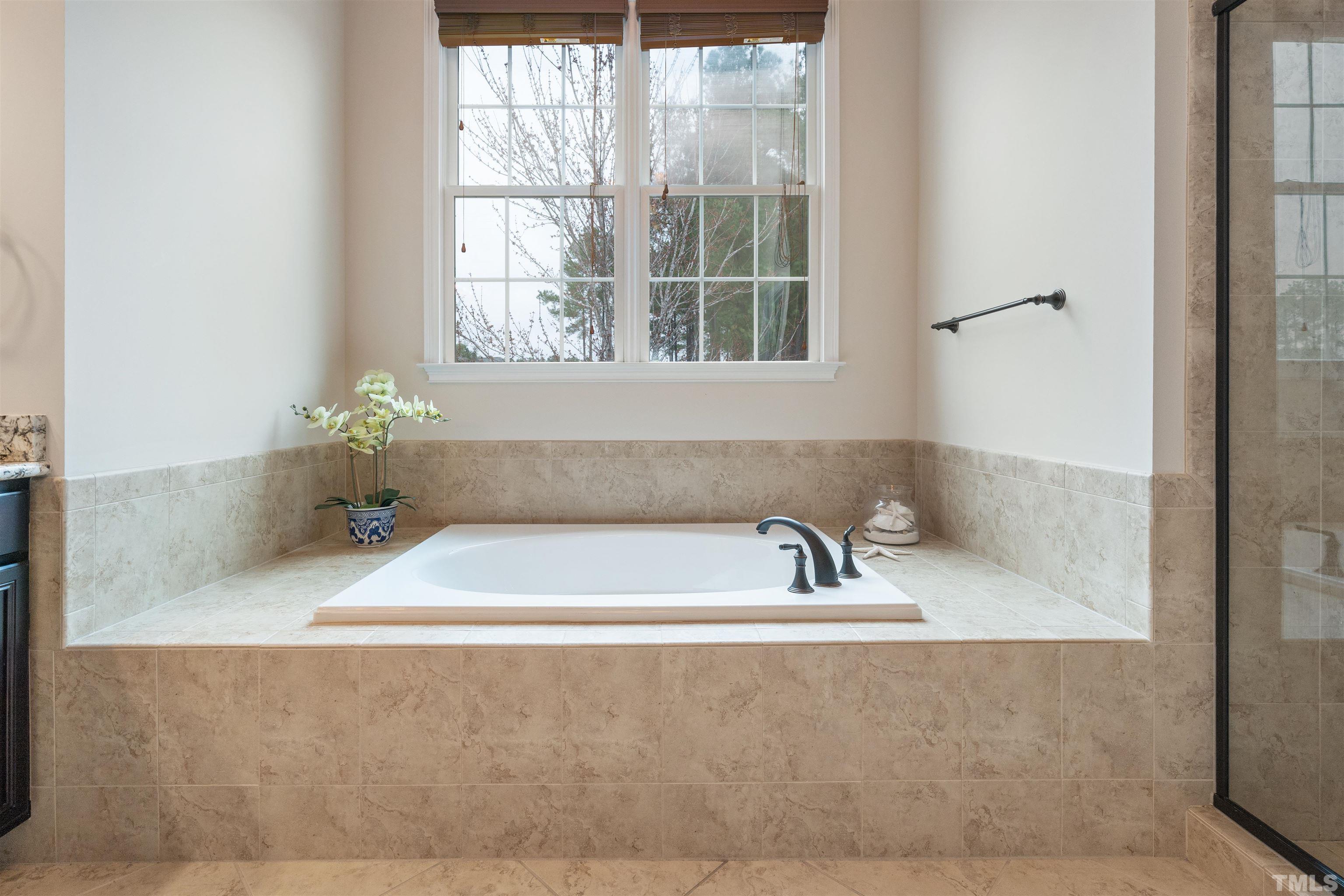 4109 Piney Gap Drive Cary, NC 27519 - Photo 25 of 39 a bathroom with a bathtub