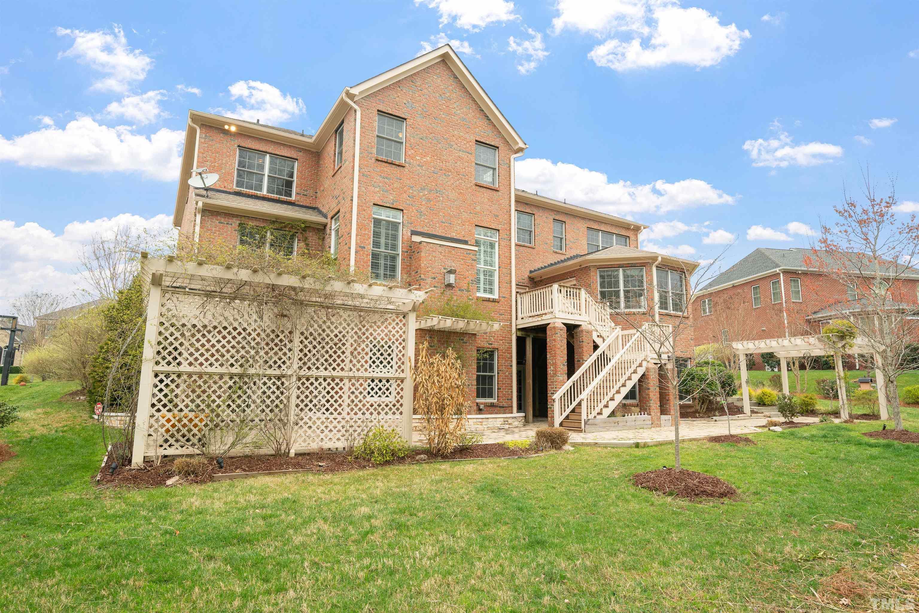 4109 Piney Gap Drive Cary, NC 27519 - Photo 35 of 39 a front view of a residential apartment building with a yard