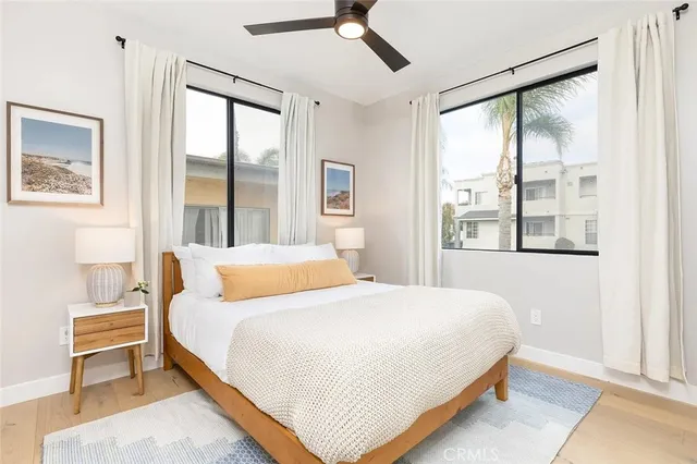 a bedroom with a large bed and a window