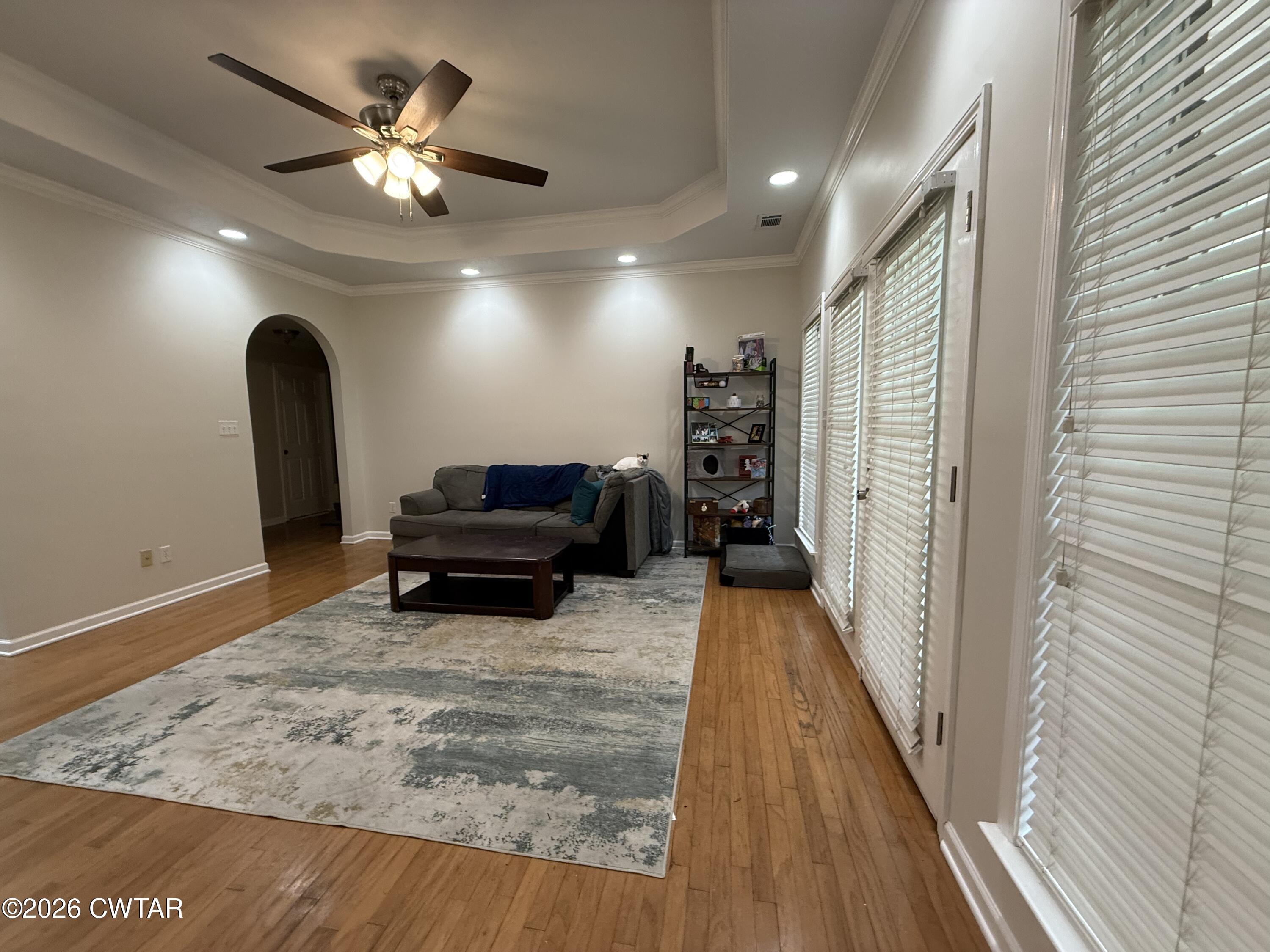 126 Waldunn Cove Rutherford, TN 38369 - Photo 6 of 18 a living room with furniture and a chandelier