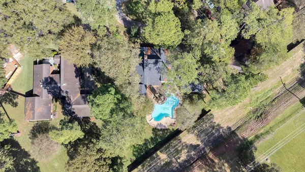 an aerial view of residential house with outdoor space