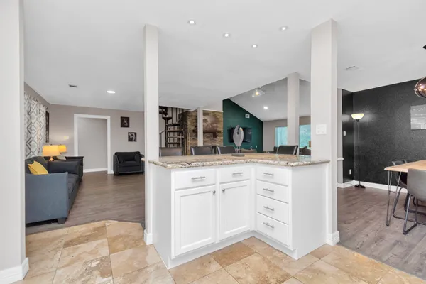 a large kitchen with a lot of counter space and a sink