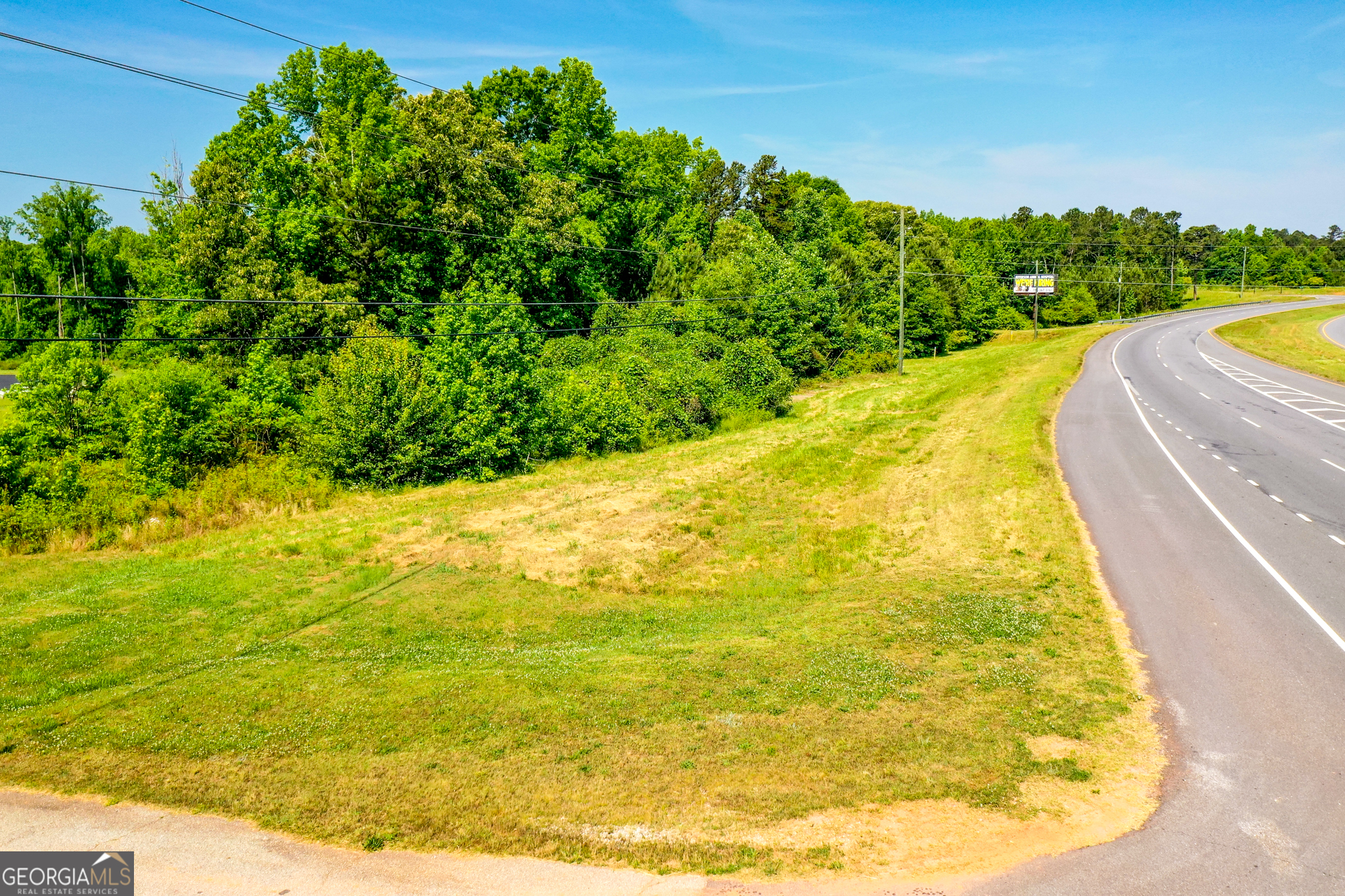 4146 Athens Highway Jefferson, GA 30549 - Photo 1 of 1 a view of a swimming pool with an outdoor space and seating area