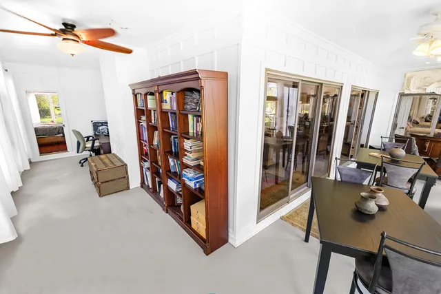 a view of a livingroom with furniture and a flat screen tv