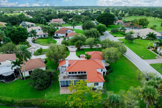 an aerial view of house with yard swimming pool and outdoor seating