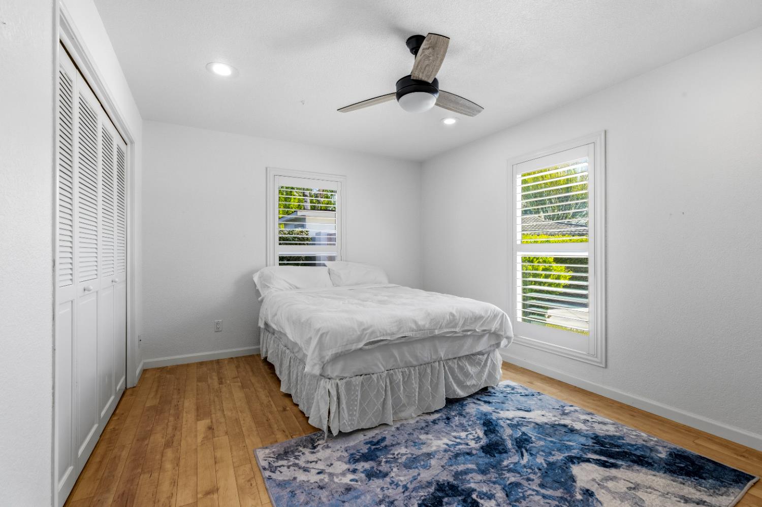 908 Newcastle Court Modesto, CA 95355 - Photo 16 of 25 a bedroom with a bed and a window