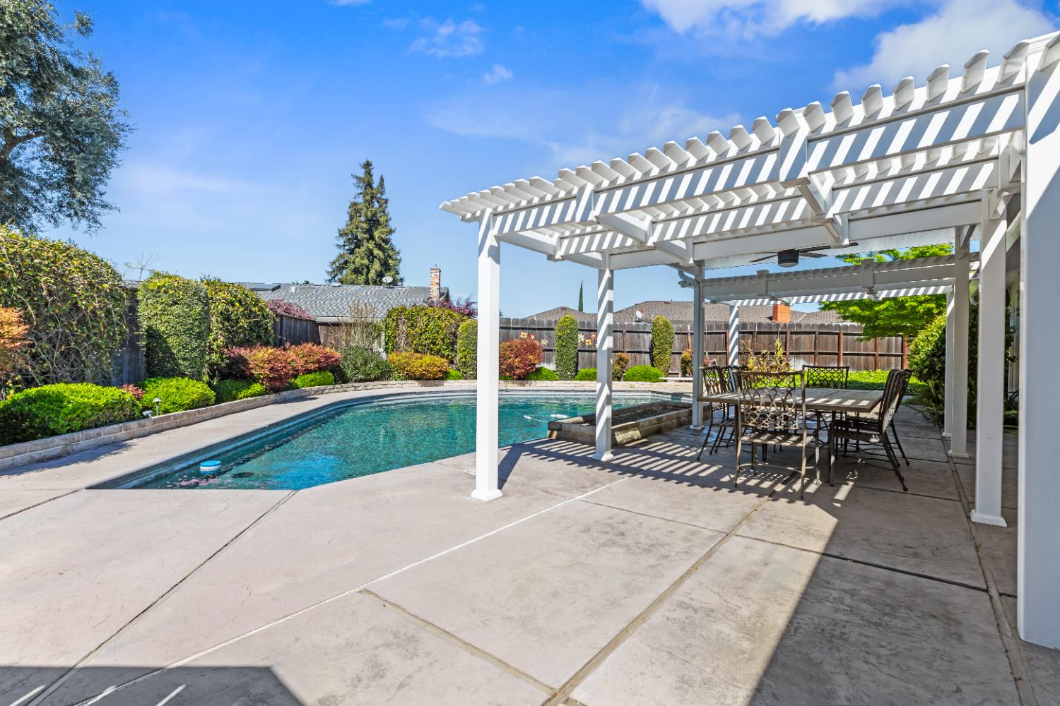 908 Newcastle Court Modesto, CA 95355 - Photo 21 of 25 a view of a patio with a table and chairs