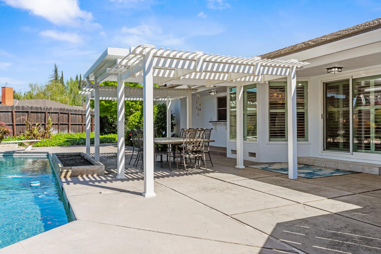 908 Newcastle Court Modesto, CA 95355 - Photo 23 of 25 a view of a house with porch and chairs
