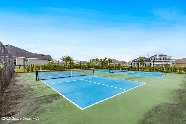 a view of an outdoor space and basketball court