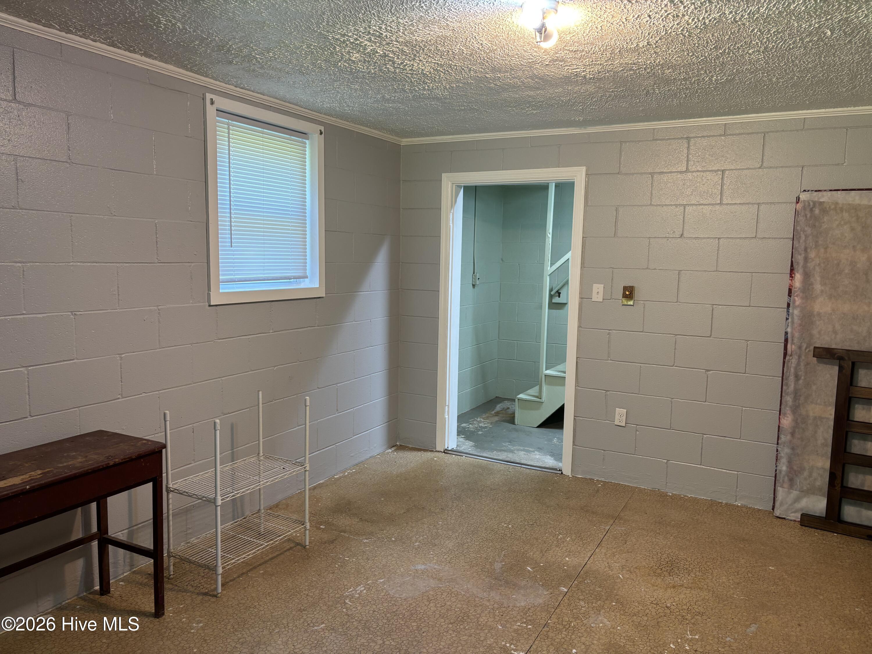 312 Neuse Cliff Road New Bern, NC 28560 - Photo 44 of 56 Room downstairs with a closet and a walk-out door.