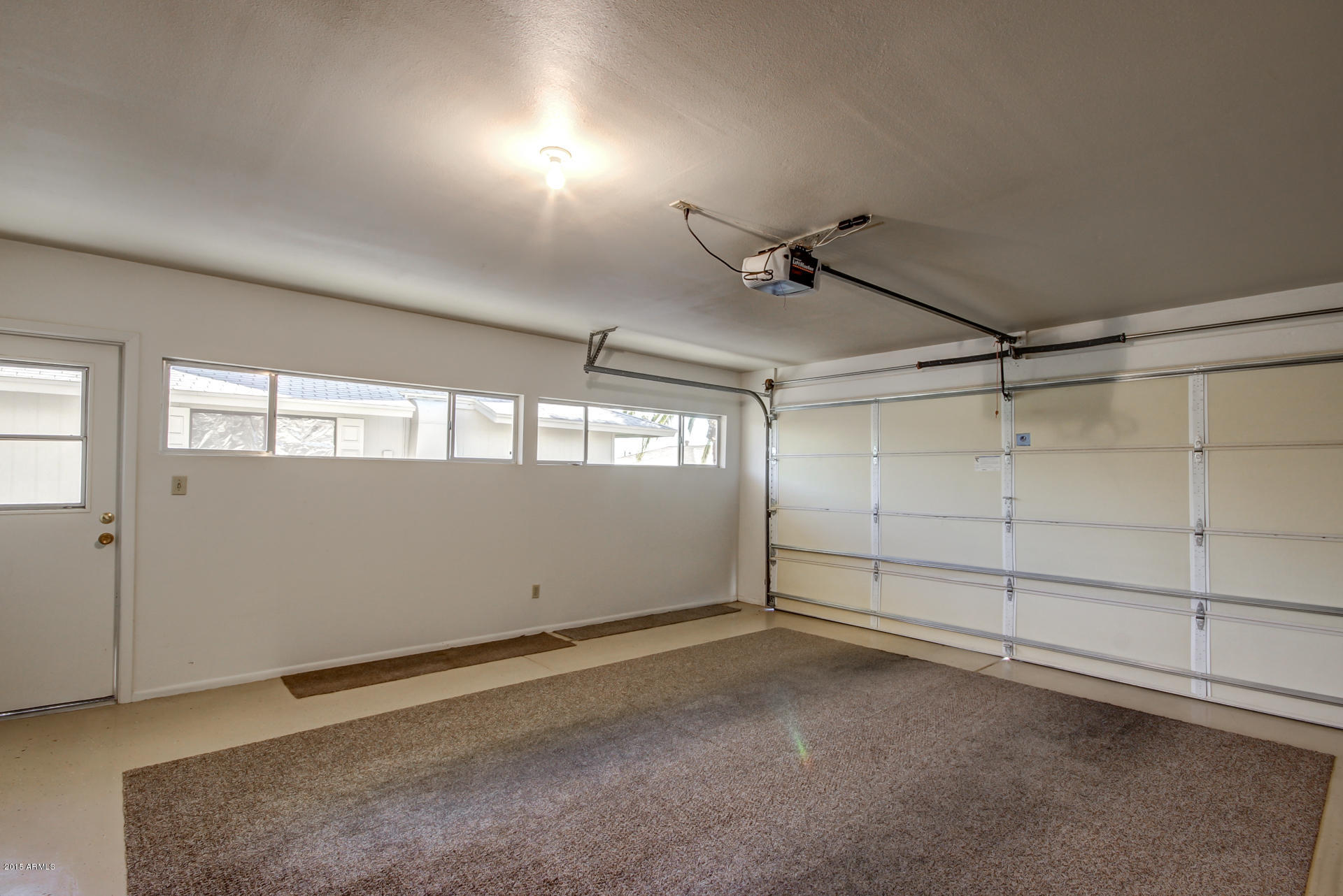 10416 West Ridgeview Road Sun City, AZ 85351 - Photo 34 of 36 Bright Garage with Insulated Door