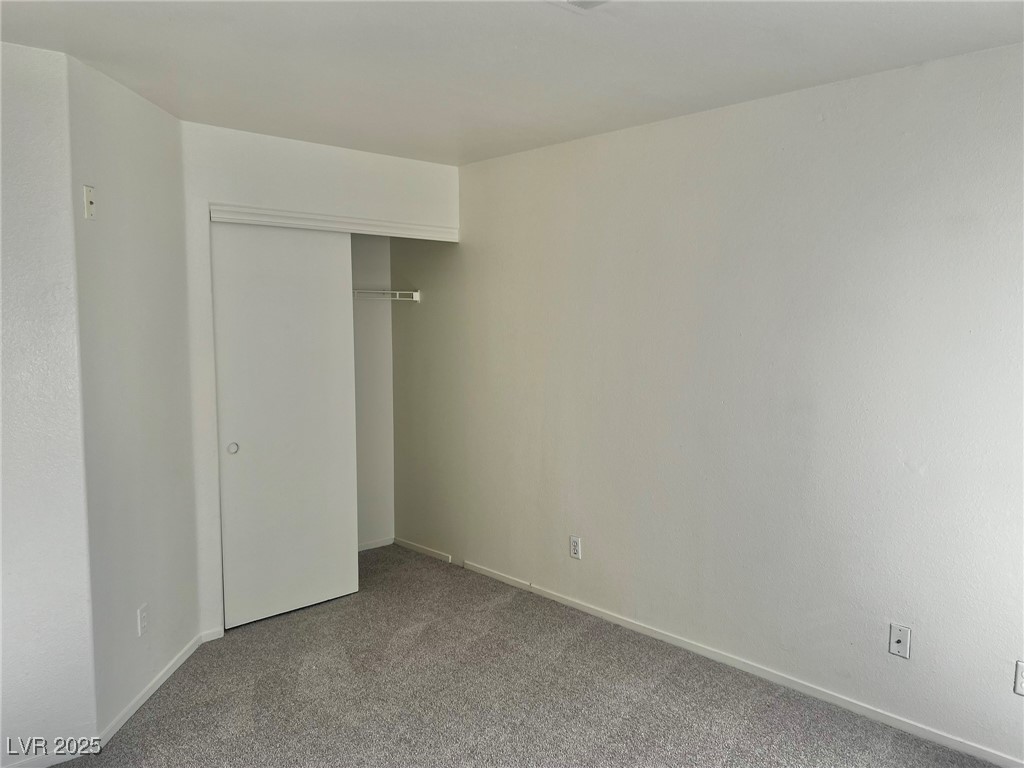 6656 Goldencreek Way, Unit HOME Las Vegas, NV 89108 - Photo 18 of 22 Unfurnished bedroom with carpet flooring and a closet