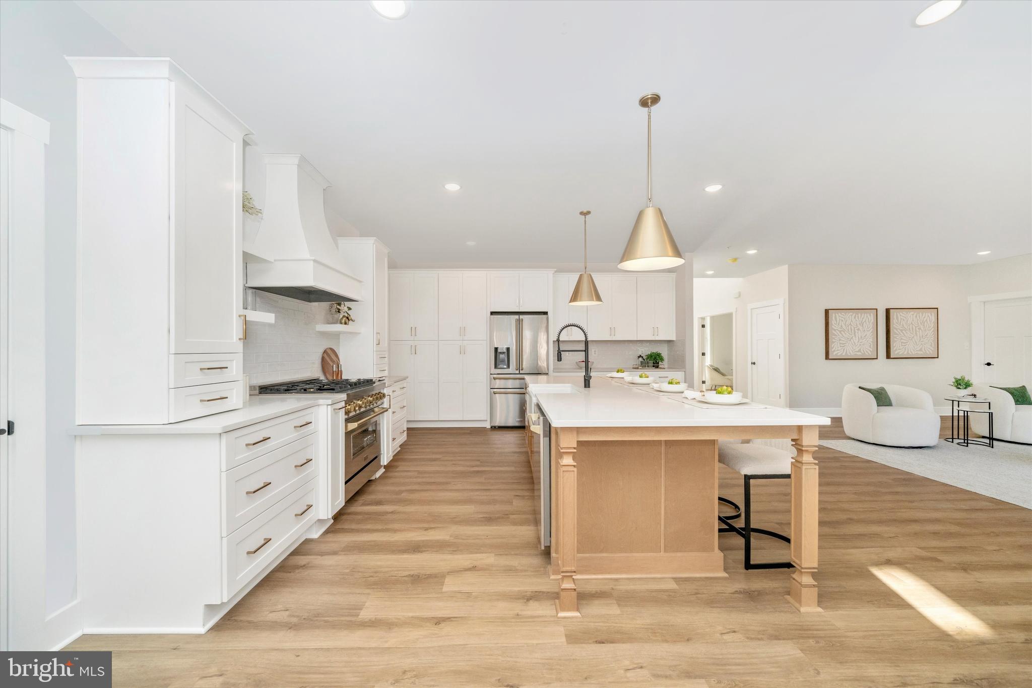 204 3 Rivers Road Harwood, MD 20776 - Photo 11 of 62 a large kitchen with kitchen island a sink counter space and stainless steel appliances