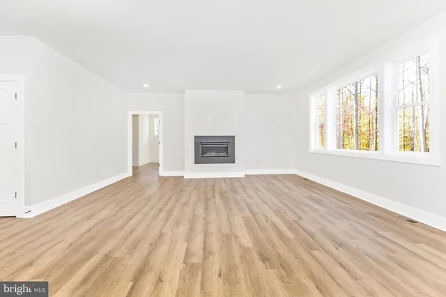 a view of a room with rack on the wall and a window