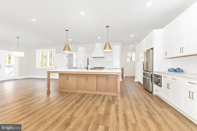 a view of room with window and hardwood floor