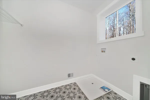 a bedroom with a bed and a fireplace