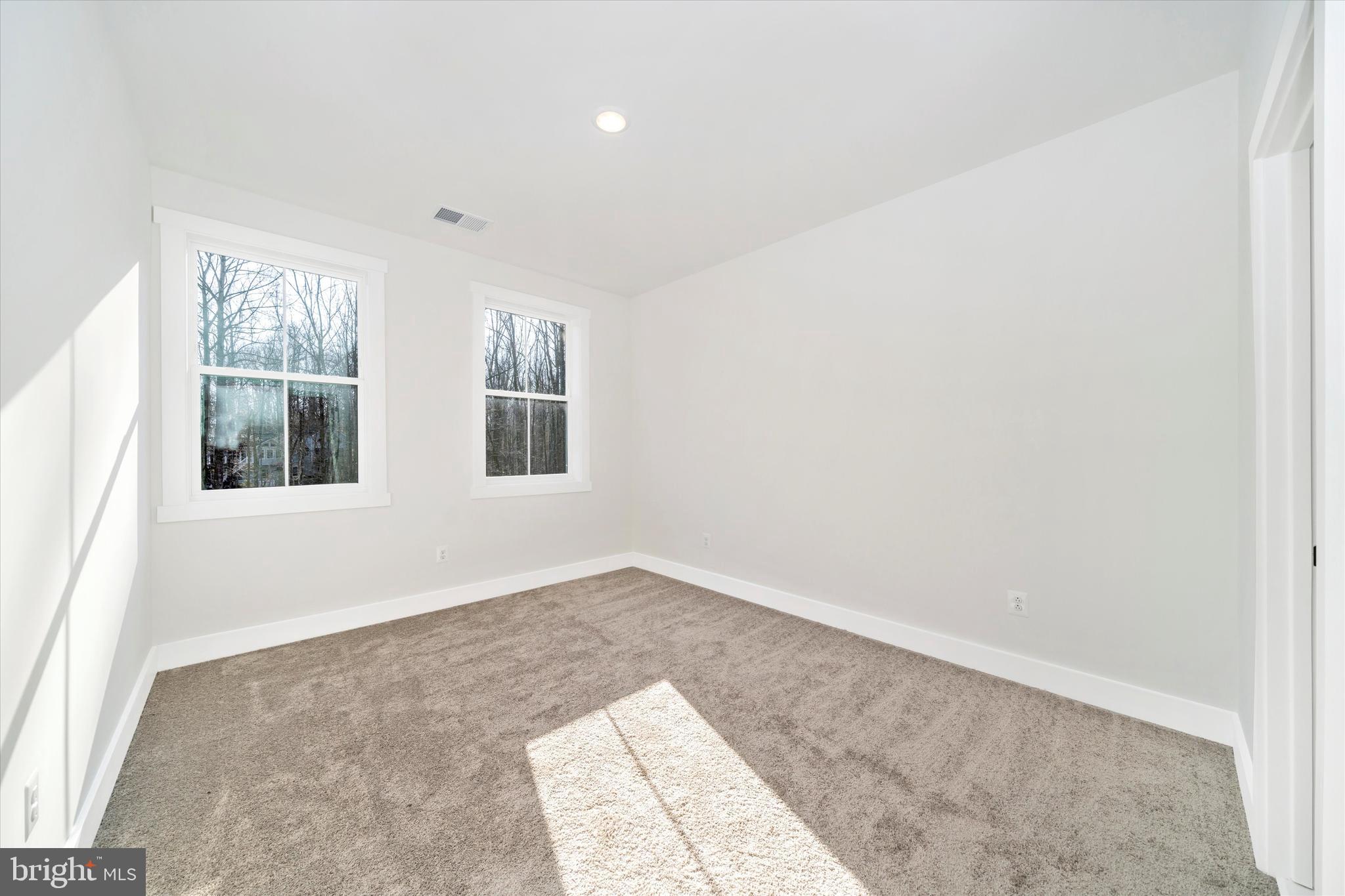 204 3 Rivers Road Harwood, MD 20776 - Photo 28 of 62 an empty room with windows