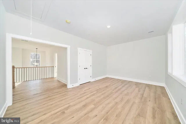 a bathroom with a sink a toilet and a large mirror