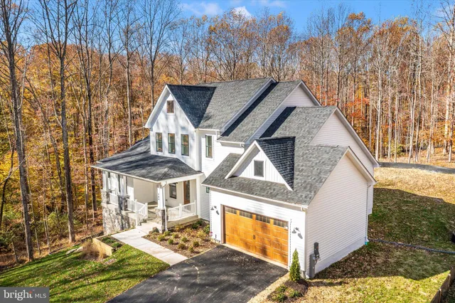 a aerial view of a house with a yard