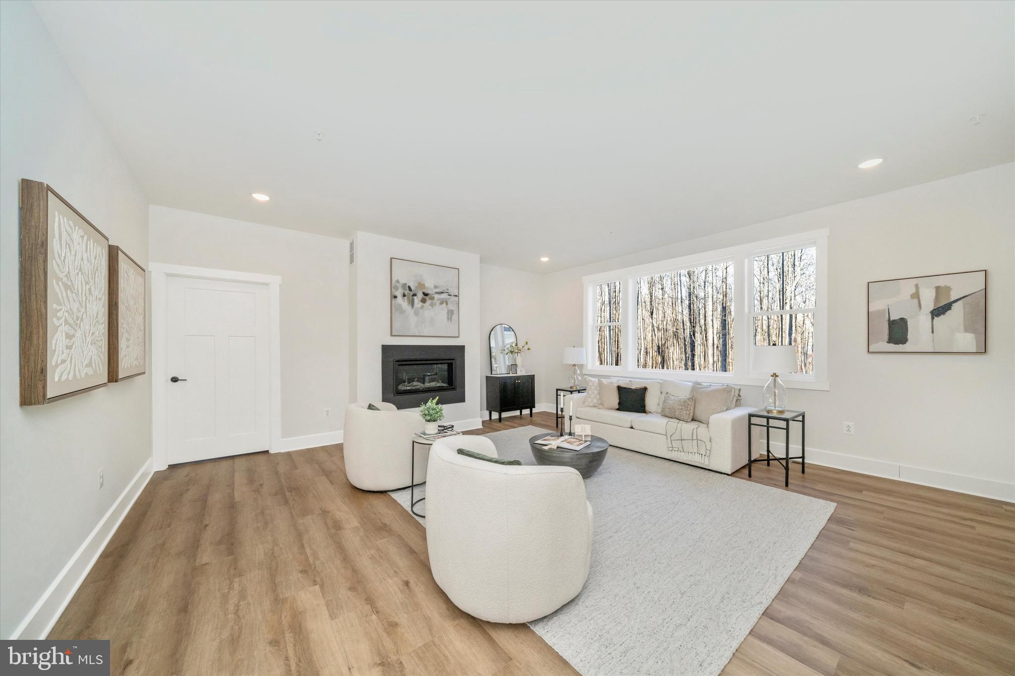 204 3 Rivers Road Harwood, MD 20776 - Photo 6 of 62 a living room with furniture and a wooden floor