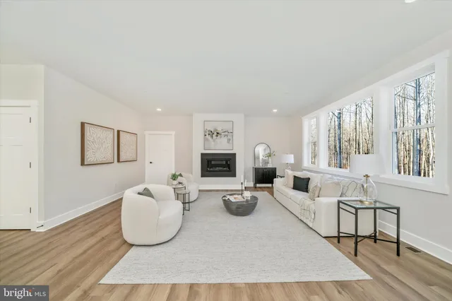 a large kitchen with a table and chairs in it