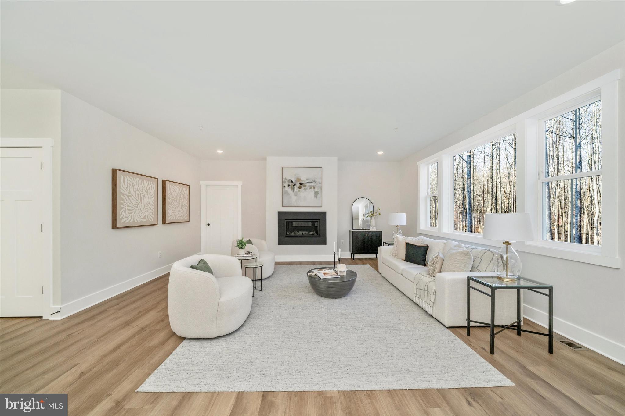 204 3 Rivers Road Harwood, MD 20776 - Photo 8 of 62 a living room with furniture and a table