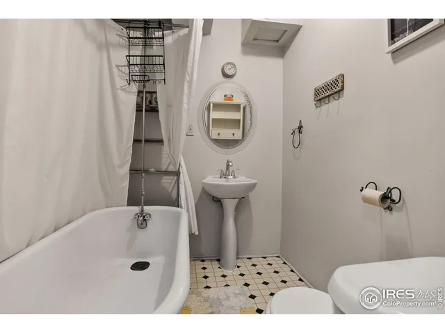 a bathroom with a sink a mirror and shower
