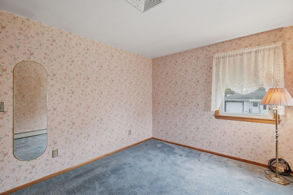 10 Deluca Road Milford, MA 01757 - Photo 27 of 37 an empty room with windows