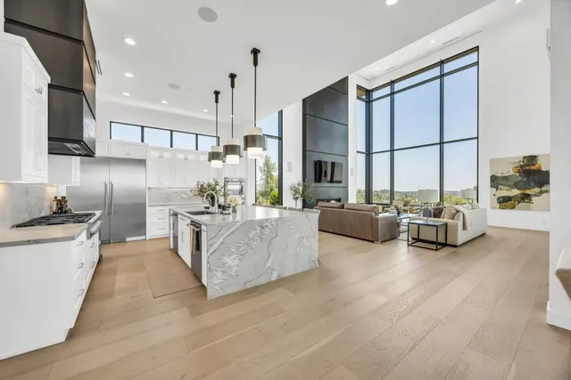 a lobby with furniture and floor to ceiling window