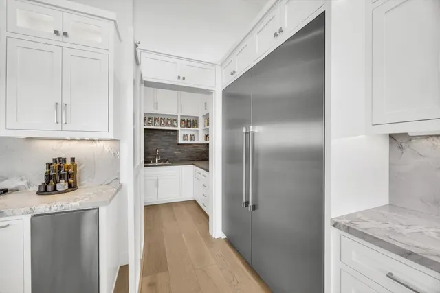 a bathroom with a sink a mirror and a shower