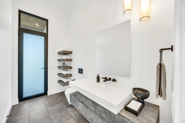 a spacious bedroom with a large bed and a large window