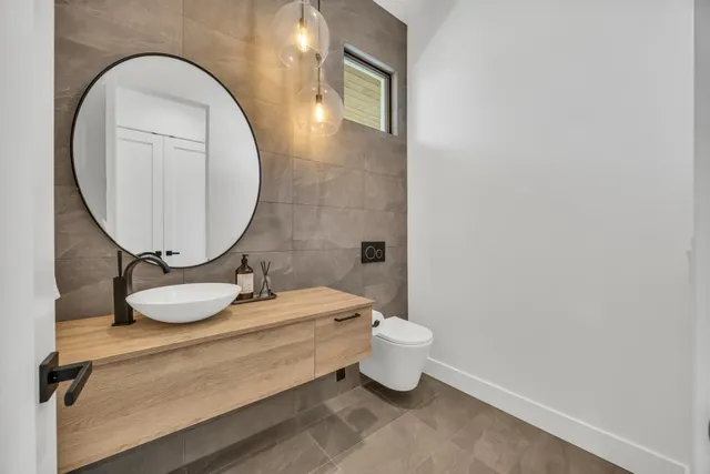 a very nice looking living room with a large window and a flat screen tv