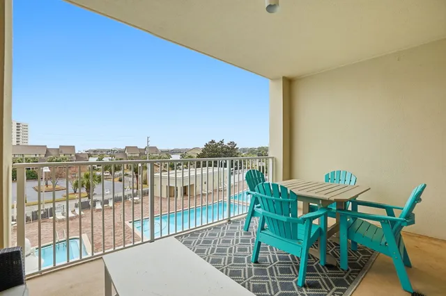 a view of a balcony with furniture