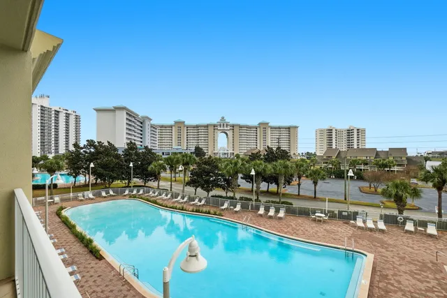 a front view of a building with outdoor seating