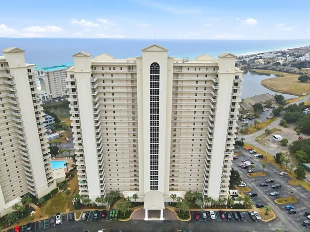 a view of a porch with furniture and floor to ceiling window
