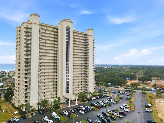 a front view of a building with a lot of windows