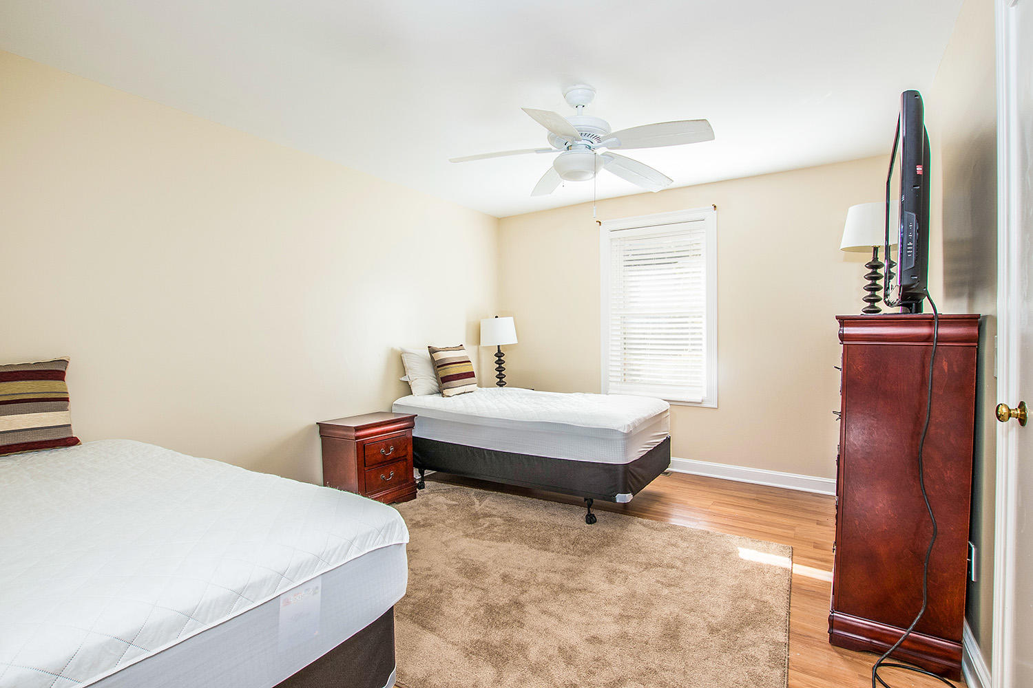 56 Daisy Hill Road Hyannis, MA 02601 - Photo 17 of 38 a bedroom with a bed and a dresser