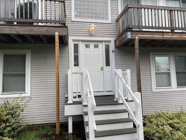 56 Daisy Hill Road Hyannis, MA 02601 - Photo 2 of 38 a front view of a house with a balcony