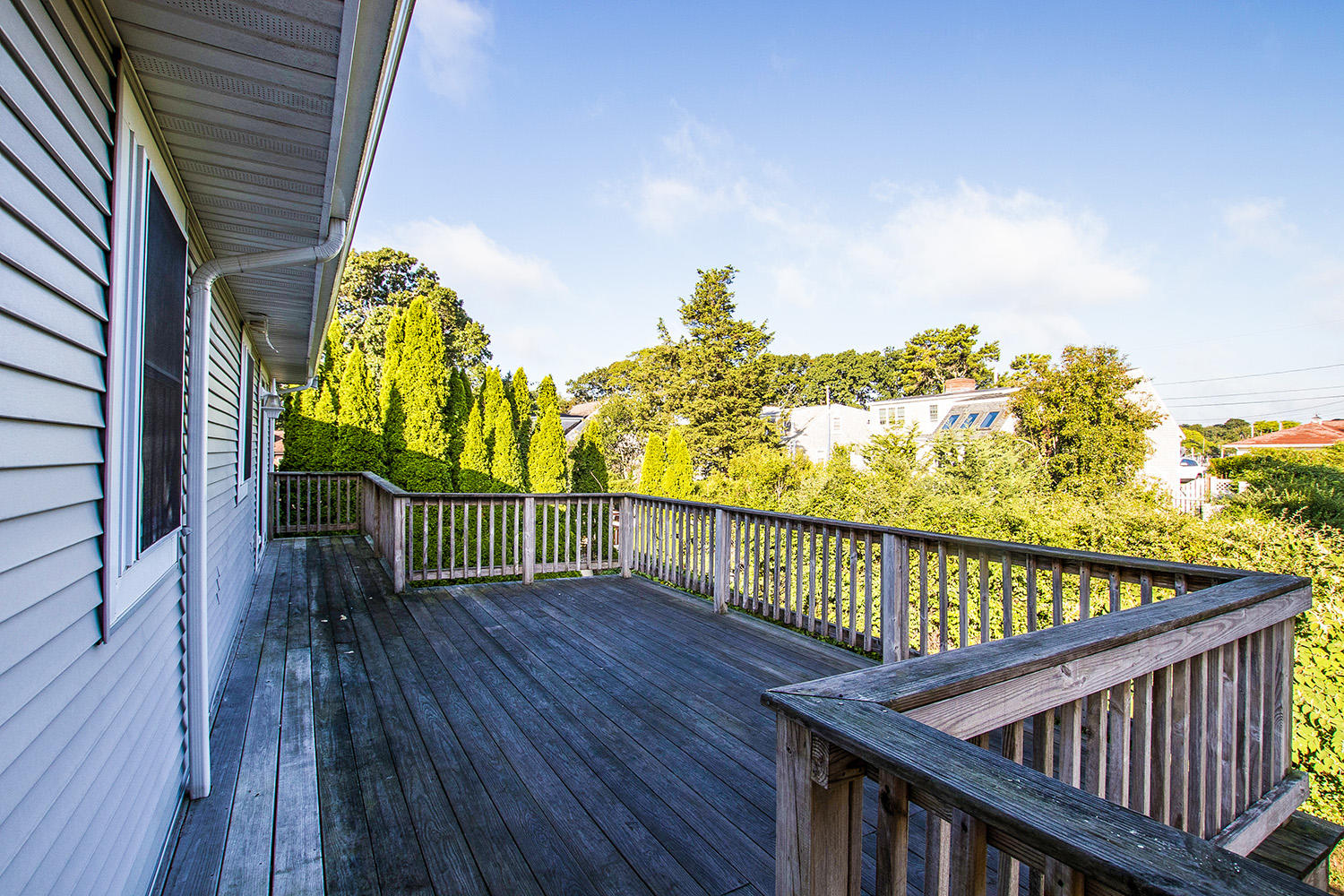 56 Daisy Hill Road Hyannis, MA 02601 - Photo 28 of 38 a view of a balcony with wooden floor