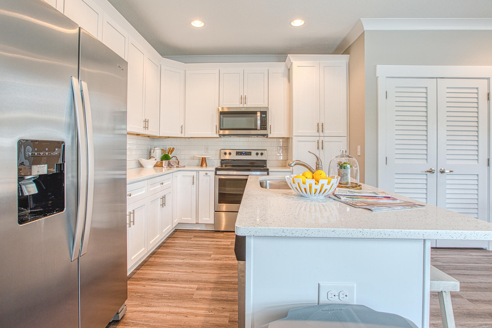 298 North Sand Palm Road, Unit 148 Freeport, FL 32439 - Photo 6 of 24 a kitchen with stainless steel appliances a stove a sink and a refrigerator